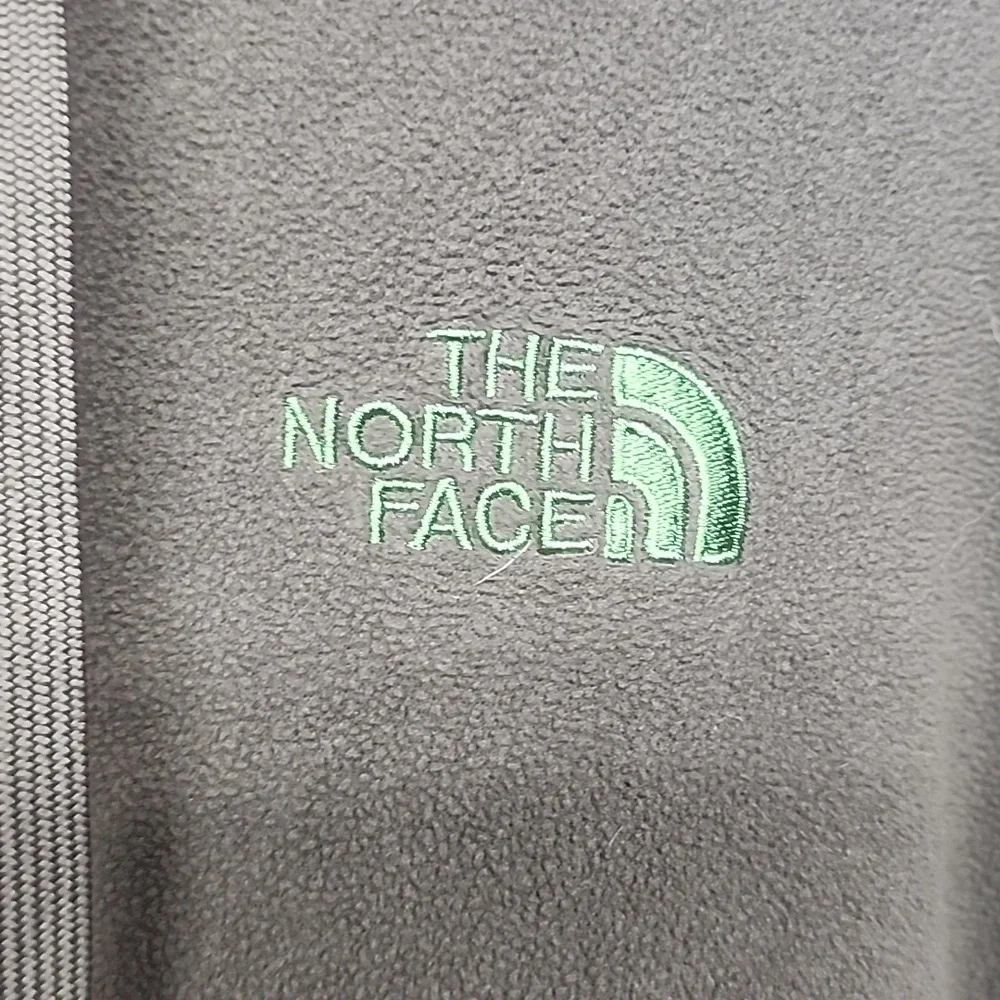 The North Face olive green embroidered  long sleeve hooded sweatshirt.